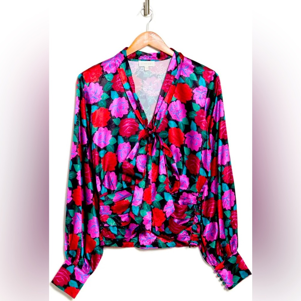 Vibrant blouse. In good used condition.